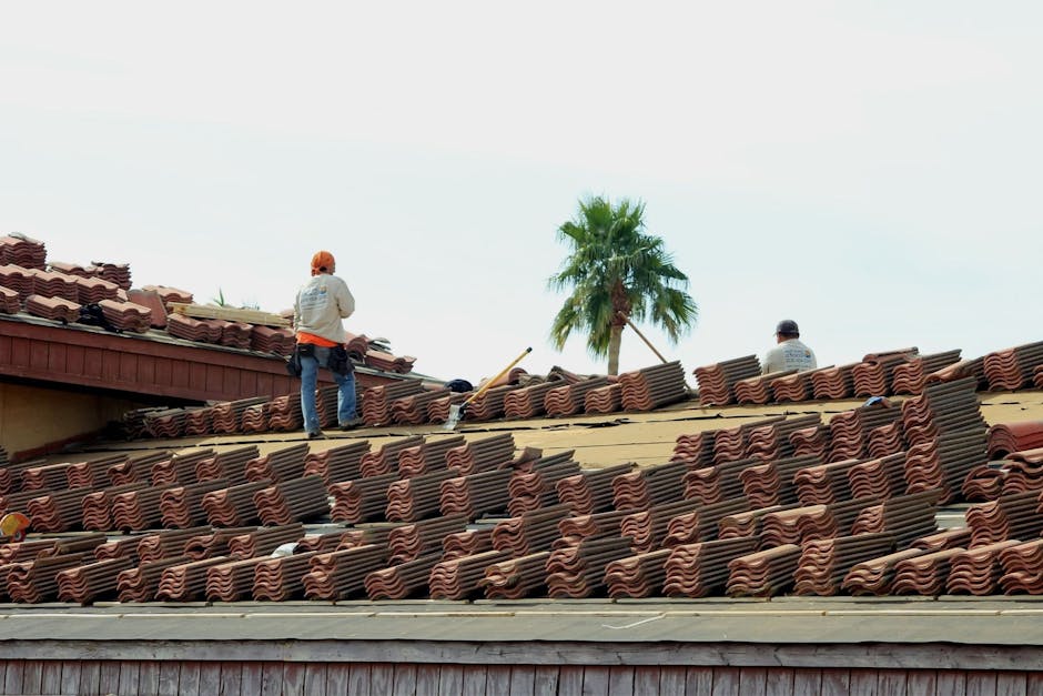 Professional roofing contractor working on residential project